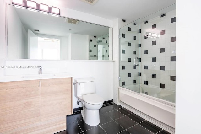 665 NE 25th St Unit 405, Miami, FL 33137 - bathroom with tile patterned flooring, toilet, combined bath / shower with glass door, and vanity