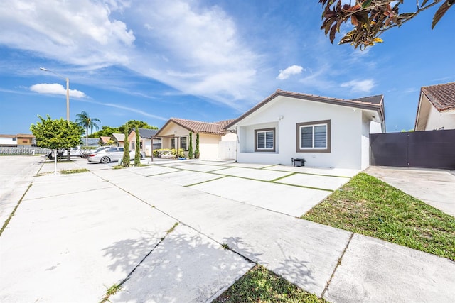 6950 NW 168th St, Hialeah, FL 33015 - view of front of home with stucco siding and a residential view