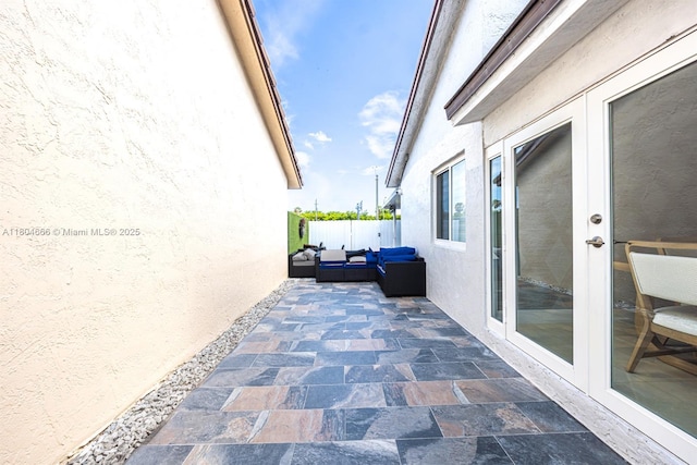 6950 NW 168th St, Hialeah, FL 33015 - view of patio with outdoor lounge area and french doors