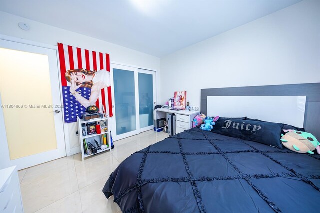 6950 NW 168th St, Hialeah, FL 33015 - tiled bedroom with a closet