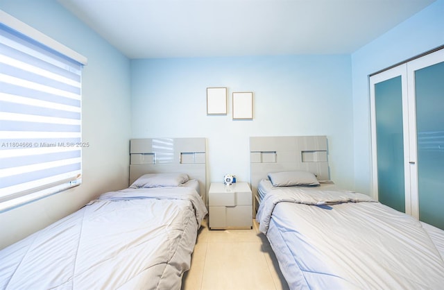 6950 NW 168th St, Hialeah, FL 33015 - tiled bedroom featuring a closet