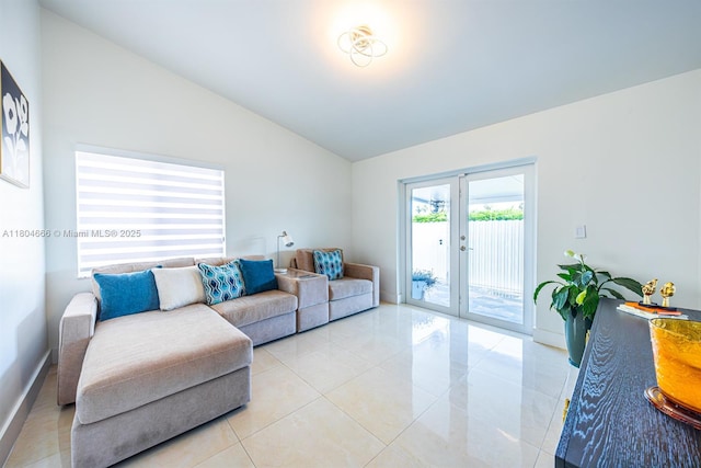6950 NW 168th St, Hialeah, FL 33015 - living area featuring vaulted ceiling and light tile patterned floors