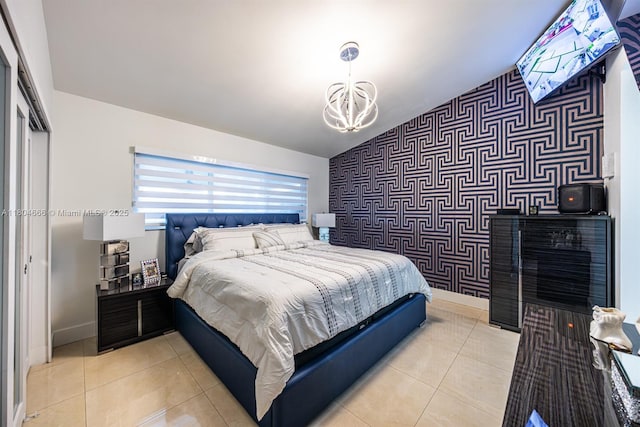 6950 NW 168th St, Hialeah, FL 33015 - bedroom featuring wallpapered walls, an accent wall, a chandelier, vaulted ceiling, and light tile patterned floors