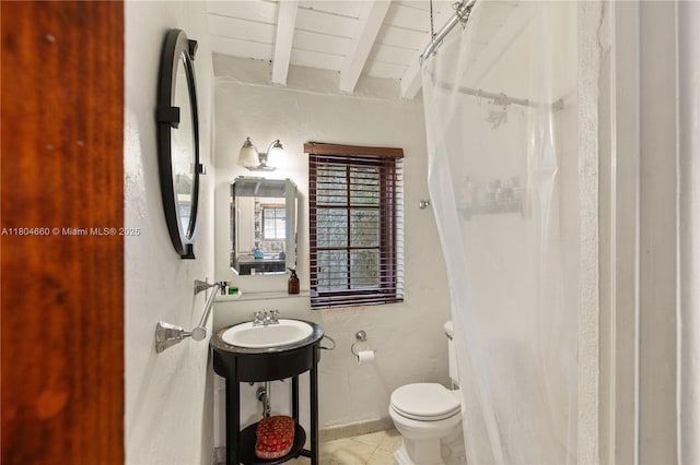 1301 Milan Ave, Villa Coral Gables, FL 33134 - bathroom featuring beamed ceiling, toilet, a sink, and curtained shower