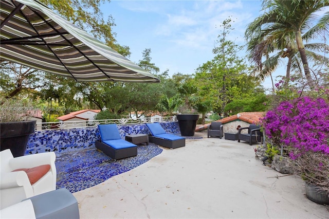 1301 Milan Ave, Villa Coral Gables, FL 33134 - view of patio with outdoor lounge area