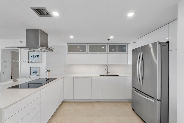 20355 NE 34th Ct Unit 929, Aventura, FL 33180 - kitchen featuring freestanding refrigerator, a sink, modern cabinets, island exhaust hood, and black electric cooktop