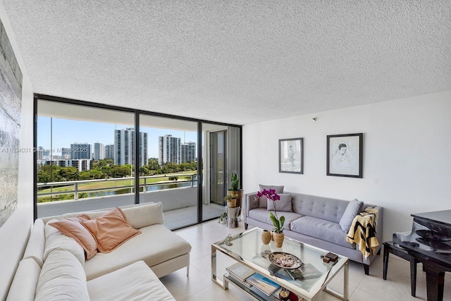 20355 NE 34th Ct Unit 929, Aventura, FL 33180 - living area with a view of skyline, a textured ceiling, a wall of windows, and a water view