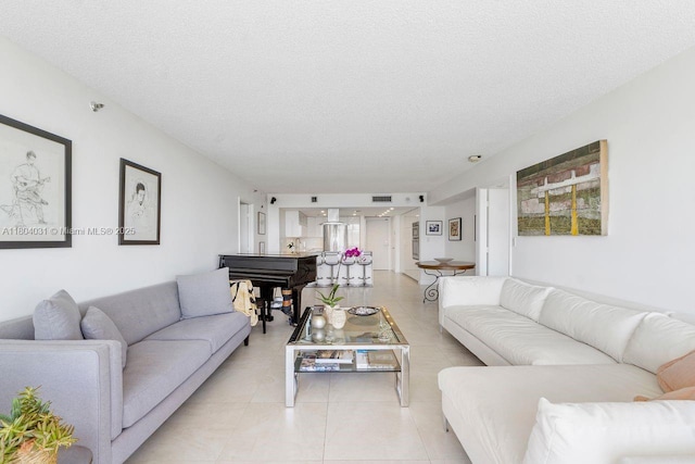 20355 NE 34th Ct Unit 929, Aventura, FL 33180 - living room with a textured ceiling and light tile patterned floors