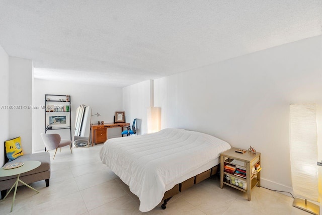 20355 NE 34th Ct Unit 929, Aventura, FL 33180 - bedroom with light tile patterned floors and a textured ceiling