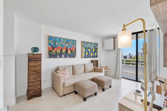 20355 NE 34th Ct Unit 929, Aventura, FL 33180 - living room featuring a textured ceiling and light tile patterned floors