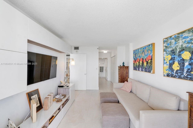 20355 NE 34th Ct Unit 929, Aventura, FL 33180 - living room with a textured ceiling and light tile patterned flooring