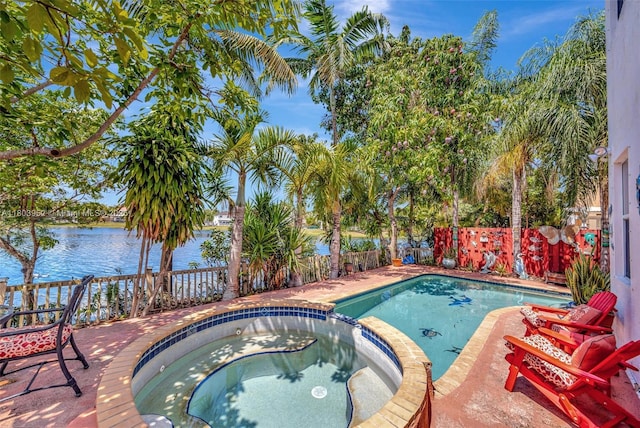 9053 SW 214th St, Cutler Bay, FL 33189 - view of swimming pool featuring a water view, a fenced backyard, and a pool with connected hot tub