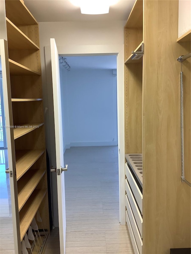150 SE 25th Rd Unit 14H, Miami, FL 33129 - spacious closet featuring light wood-type flooring