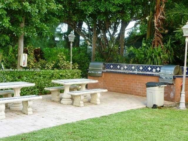 150 SE 25th Rd Unit 14H, Miami, FL 33129 - view of patio / terrace with exterior kitchen and grilling area