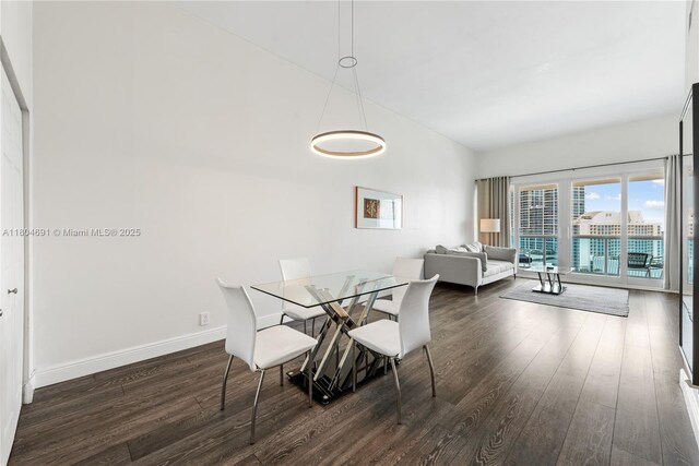 6770 Indian Creek Dr Unit Tsa1, Miami Beach, FL 33141 - dining area featuring wood finished floors and baseboards