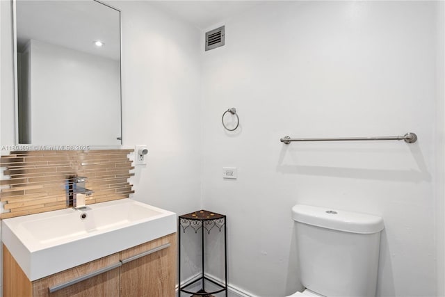 6770 Indian Creek Dr Unit Tsa1, Miami Beach, FL 33141 - half bath featuring backsplash, toilet, and vanity