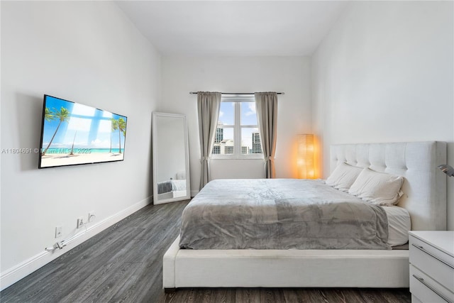 6770 Indian Creek Dr Unit Tsa1, Miami Beach, FL 33141 - bedroom featuring dark wood-style floors and baseboards
