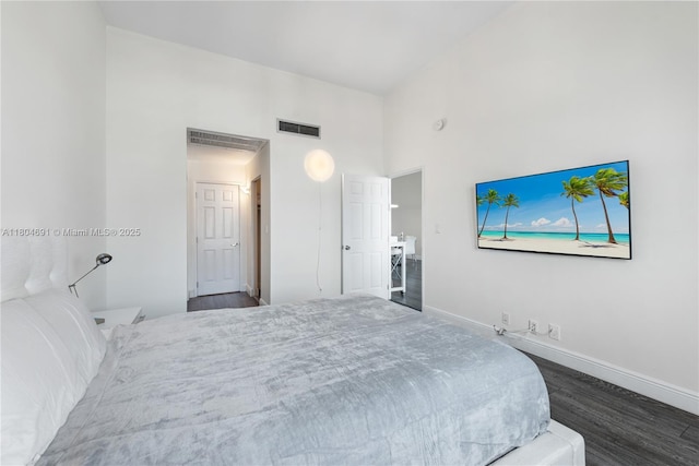 6770 Indian Creek Dr Unit Tsa1, Miami Beach, FL 33141 - bedroom with dark wood-style flooring and baseboards