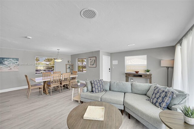 1950 NE 55th Ct, Fort Lauderdale, FL 33308 - living area with baseboards and light wood-style flooring