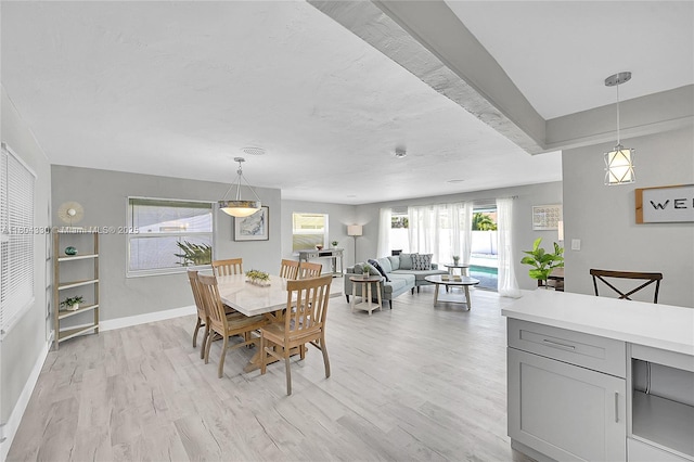 1950 NE 55th Ct, Fort Lauderdale, FL 33308 - dining room with light wood-style floors and baseboards