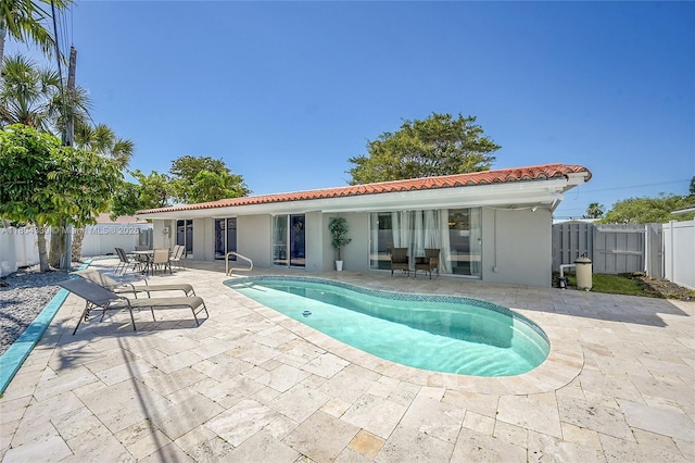 1950 NE 55th Ct, Fort Lauderdale, FL 33308 - view of swimming pool featuring a patio and a fenced backyard