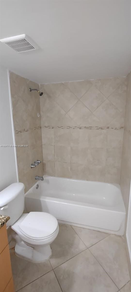 full bathroom with tub / shower combination, tile patterned flooring, toilet, and vanity