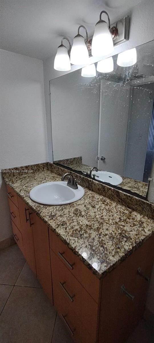 bathroom with tile patterned floors and vanity