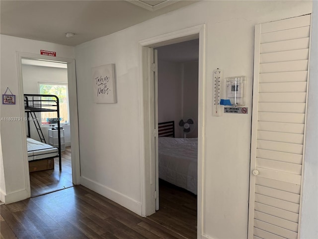 1463 NW 70th St, Miami, FL 33147 - hallway with dark wood-style flooring and baseboards