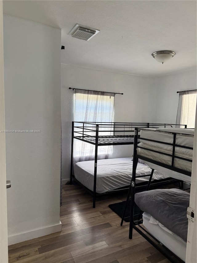 1463 NW 70th St, Miami, FL 33147 - bedroom with wood finished floors and baseboards