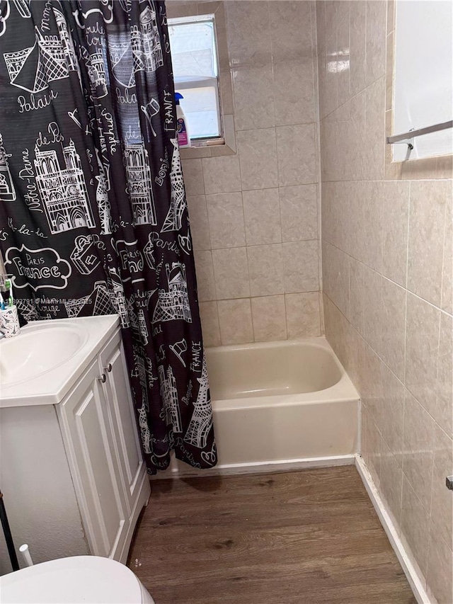 1463 NW 70th St, Miami, FL 33147 - full bath featuring wood finished floors, vanity, shower / tub combo with curtain, and toilet