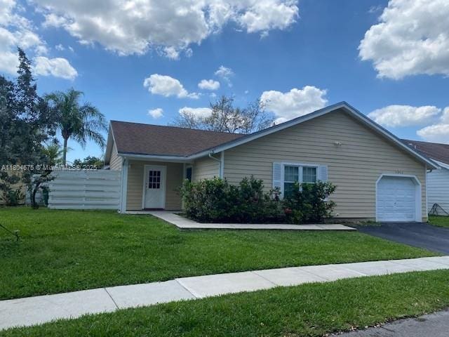 14953 SW 143rd Ct, Miami, FL 33186 - single story home with an attached garage and driveway