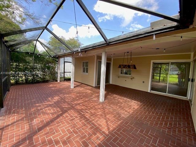 14953 SW 143rd Ct, Miami, FL 33186 - view of patio / terrace featuring a lanai