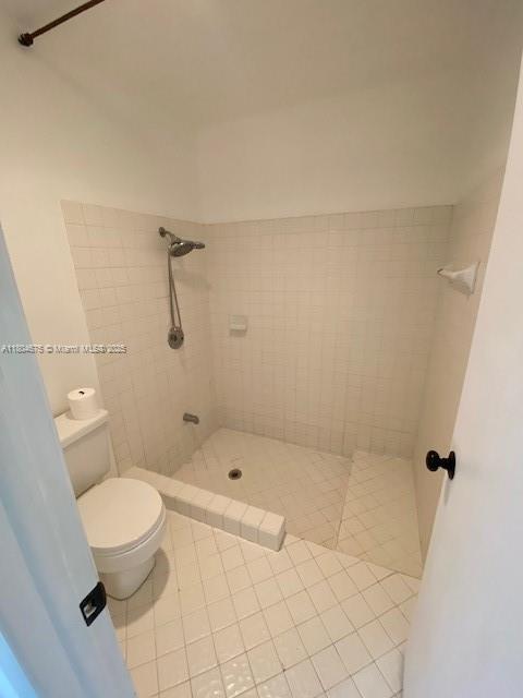 14953 SW 143rd Ct, Miami, FL 33186 - full bath with a stall shower, toilet, and tile patterned flooring