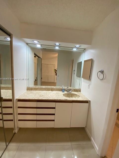14953 SW 143rd Ct, Miami, FL 33186 - bathroom with tile patterned flooring, vanity, and baseboards