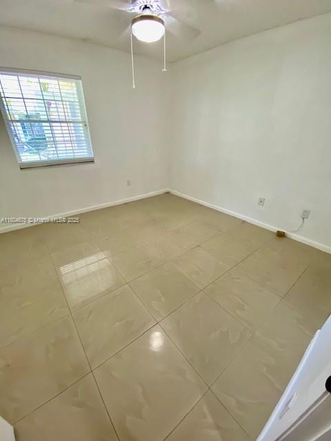14953 SW 143rd Ct, Miami, FL 33186 - empty room featuring ceiling fan and baseboards