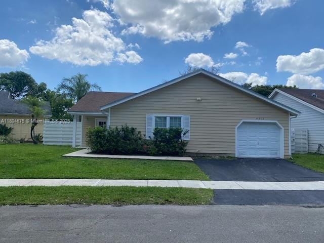 14953 SW 143rd Ct, Miami, FL 33186 - view of front of house featuring an attached garage and driveway