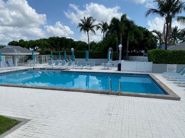 14953 SW 143rd Ct, Miami, FL 33186 - community pool featuring fence and a patio area