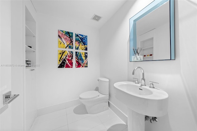 2950 NE 188th St Unit 540, Aventura, FL 33180 - half bathroom featuring toilet, tile patterned floors, and baseboards
