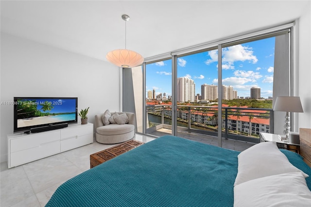 2950 NE 188th St Unit 540, Aventura, FL 33180 - tiled bedroom with a skyline view, access to exterior, and expansive windows