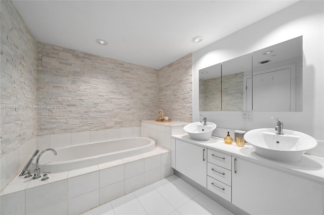 2950 NE 188th St Unit 540, Aventura, FL 33180 - bathroom with tile patterned floors, a bath, double vanity, and recessed lighting