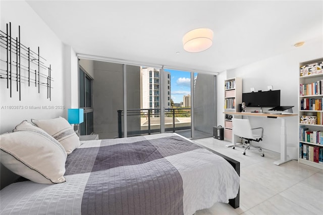 2950 NE 188th St Unit 540, Aventura, FL 33180 - tiled bedroom featuring access to exterior, floor to ceiling windows, and an office area