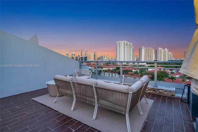 2950 NE 188th St Unit 540, Aventura, FL 33180 - view of patio featuring a view of skyline, a balcony, and outdoor lounge area