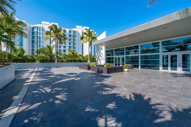 2950 NE 188th St Unit 540, Aventura, FL 33180 - view of patio / terrace featuring french doors and outdoor lounge area