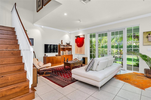 2626 Sawyer Ter, Wellington, FL 33414 - living area featuring light tile patterned flooring, crown molding, healthy amount of natural light, stairway, and recessed lighting