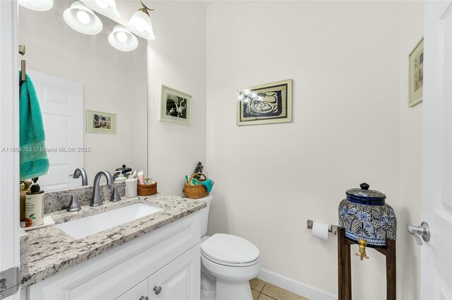 2626 Sawyer Ter, Wellington, FL 33414 - half bathroom with tile patterned flooring, toilet, vanity, and baseboards