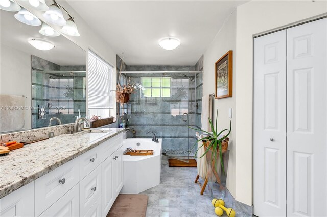 2626 Sawyer Ter, Wellington, FL 33414 - bathroom featuring a stall shower, vanity, a freestanding tub, and a closet