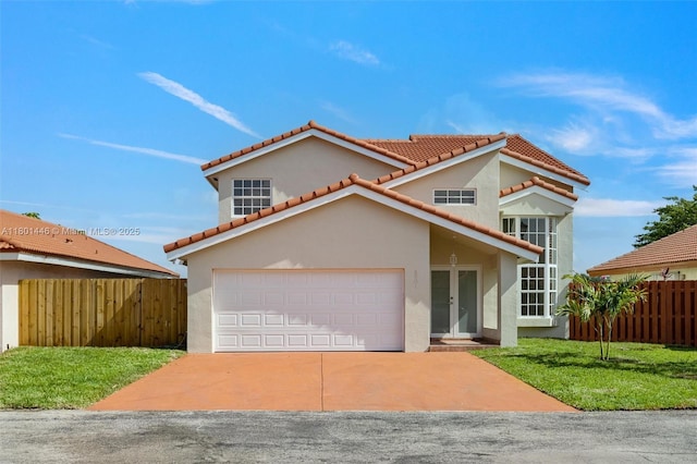 8501 NW 191st St, Hialeah, FL 33015 - mediterranean / spanish-style house featuring a tiled roof, stucco siding, driveway, and a garage