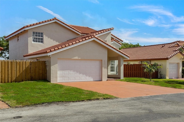 8501 NW 191st St, Hialeah, FL 33015 - mediterranean / spanish-style home featuring an attached garage, stucco siding, concrete driveway, and a tile roof
