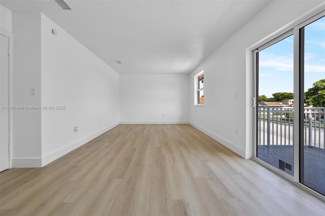 8501 NW 191st St, Hialeah, FL 33015 - spare room featuring light wood-type flooring and baseboards