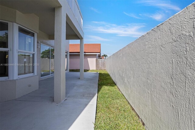 8501 NW 191st St, Hialeah, FL 33015 - fenced backyard featuring a patio